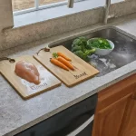 separate cutting boards for raw meat, poultry, and produce to prevent the spread of bacteria